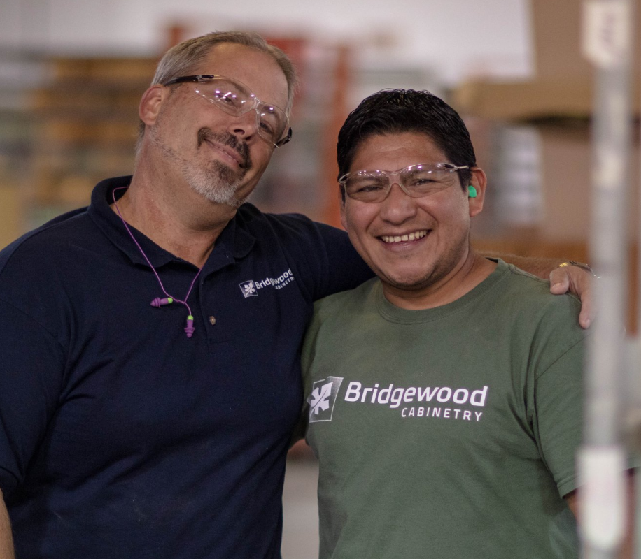 Bridgewood cabinetry employees smile for a photo