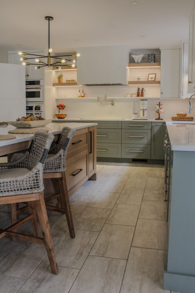 Kitchen cabinetry and island made of white oak. The cabinetry has been finished with Acacia Haze and the island has been stained with the natural light wash stain.