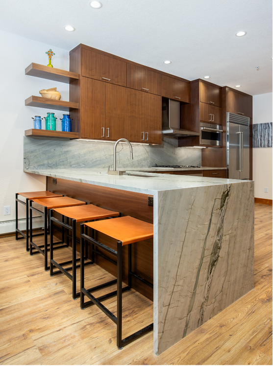 Caramel stained maple cabinetry with scandia v doors in a sophisticated kitchen