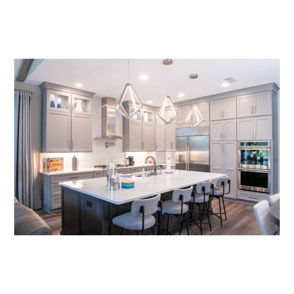 Maple kitchen cabinetry painted with a pewter finish with a maple island stained Onyx