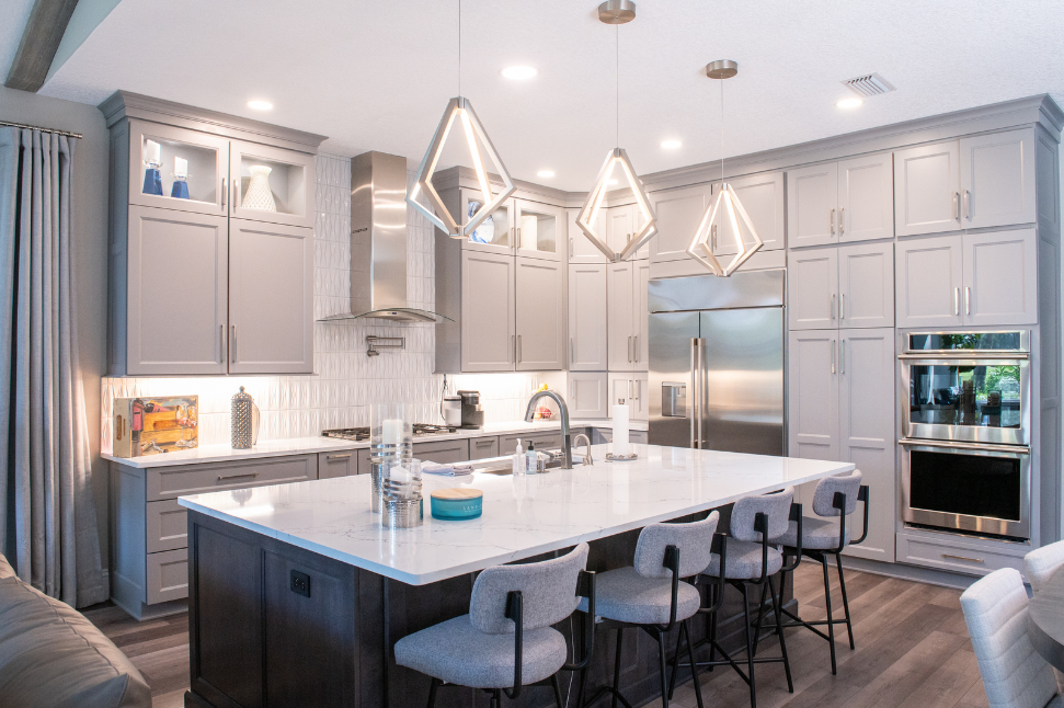 Maple kitchen cabinetry painted with a pewter finish with a maple island stained Onyx