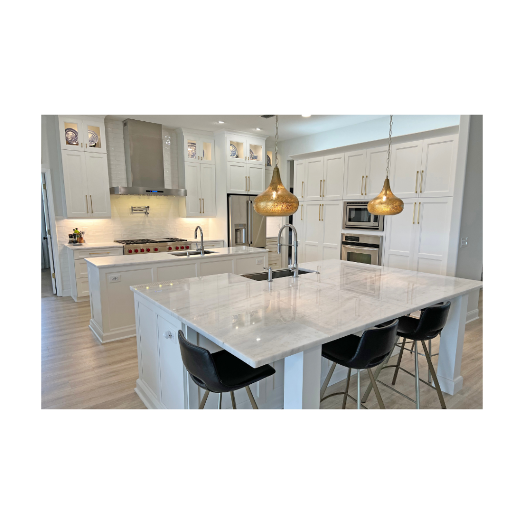 Finished maple kitchen cabinetry and island featuring portland doors in the color snow