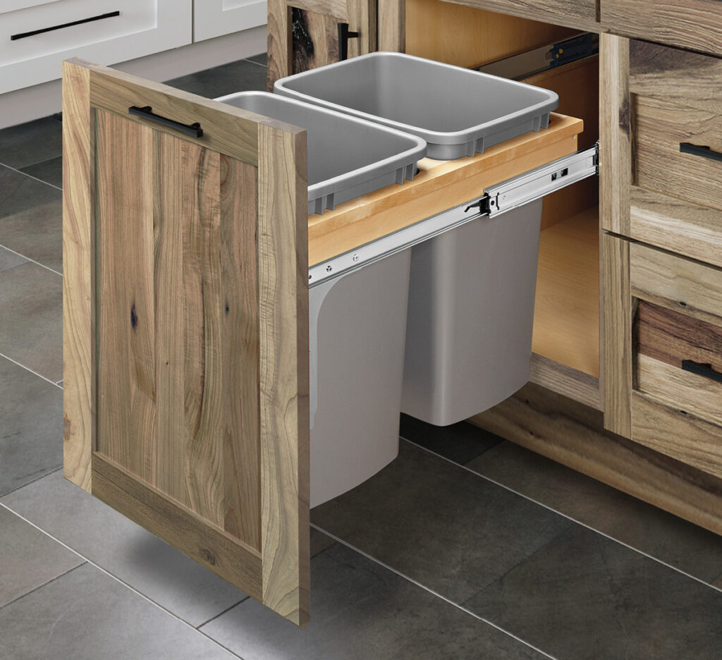 Top mount double waste container pullout drawer with dovetail construction.