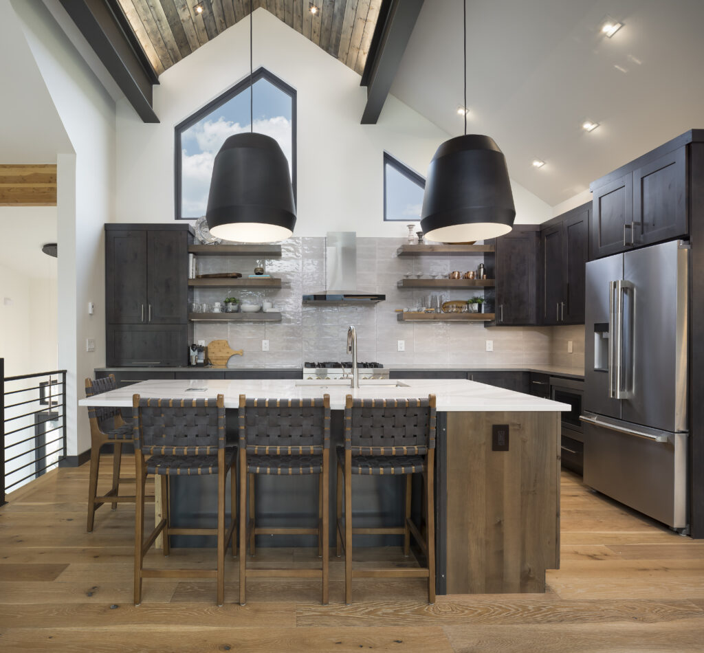 Knotty alder kitchen cabinetry and island with mission door styles. Cabinetry is stained in the shade iron and island is stained in the shade caramel.