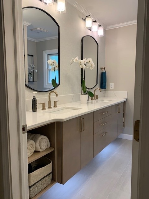 Floating bathroom vanity made of maple painted with warm grey finish featuring scandia doors