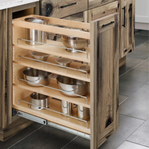 Base cabinet pullout with adjustable wooden shelves, featuring metal hardware and metal retaining bars.