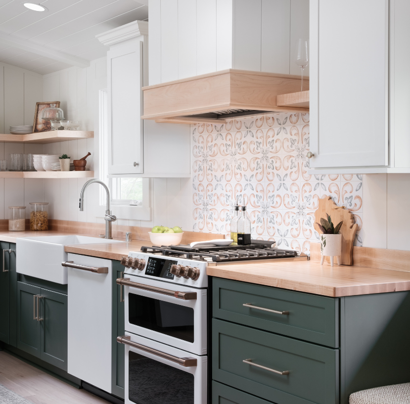 Custom kitchen cabinetry made with painted maple in the colors alabaster and custom green